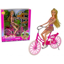 Lėlė su dviračiu
